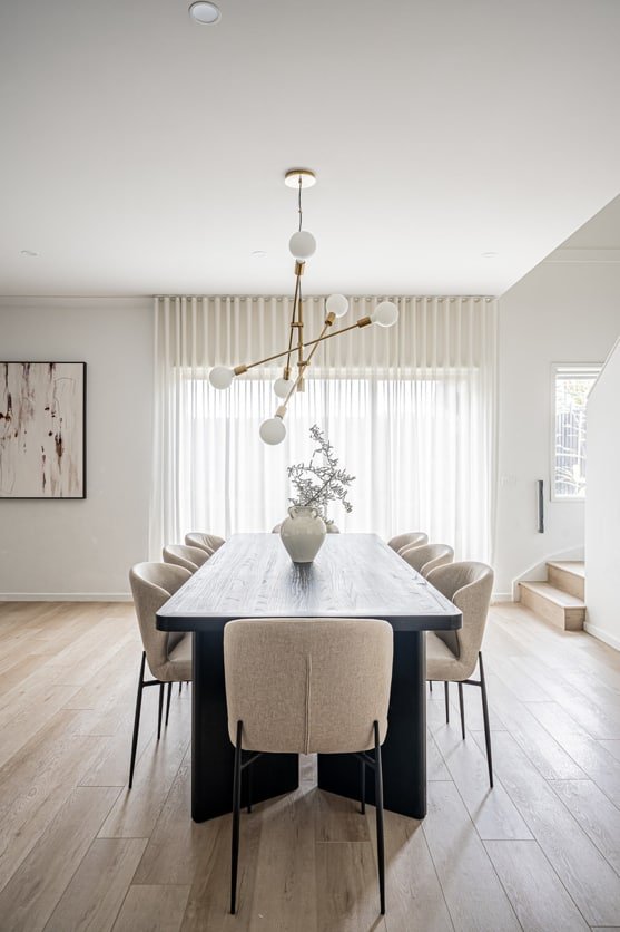 Dining Room with Sheer Curtains and Chandelier in Al Quoz